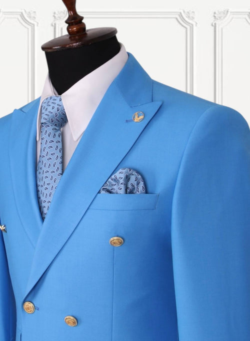 Bright blue GEEMAN suit lapel and gold button detail